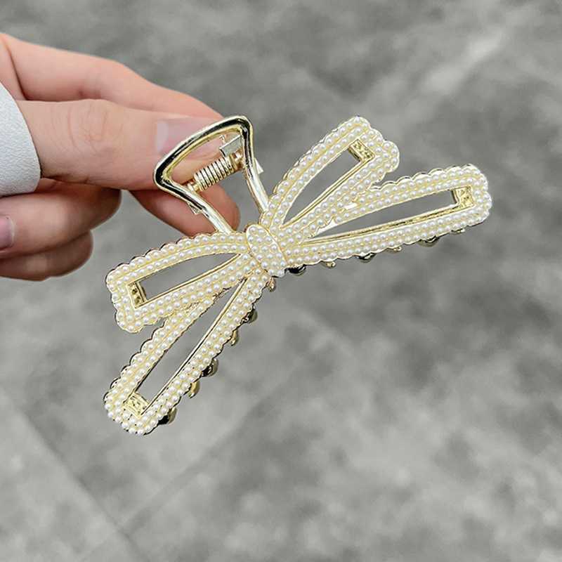 

Korean temperament pearl bow large grab clip high sense elegant hairpin net red fashion back head shark clip