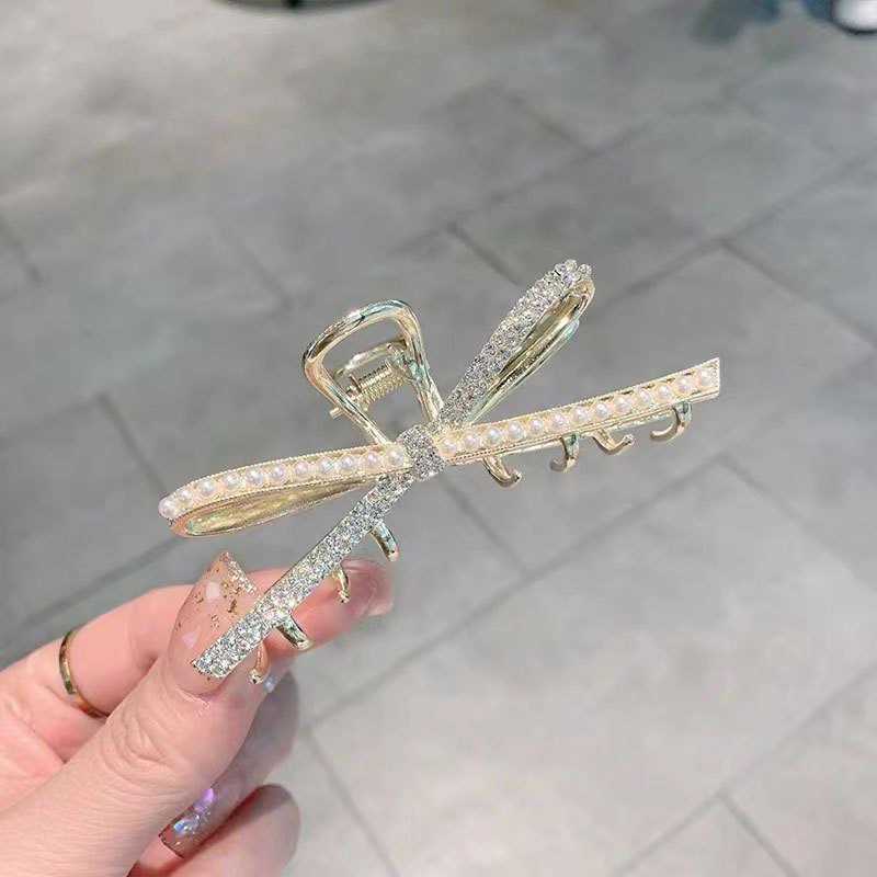 

Hair Clips Korean pearl bow medium grip clip elegant net red disc hairpin shark back head