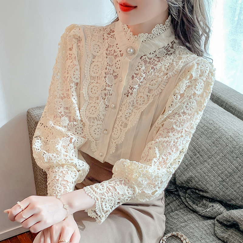 Blouse de dentelle de mode Femmes blanches Shirt Spring Puff Sleeve Slim Stand Collier Hollow Lace Stitch Top Elegant Blouses