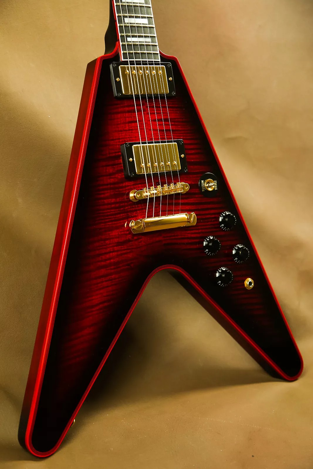 

Custom aircraft v electric guitar 24frets ABR-1 bridge Peach heart wood body flame maple top Ebony fingerboard abalone inlay Red binding