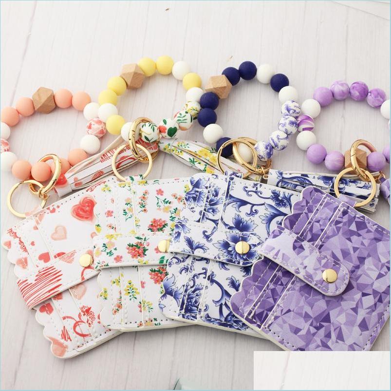 

Keychains Lanyards Sile Bead Bracelet Card Case Wooden Wrist Keychain Pendant Anti-Lost Tassel Keyring For Women Girls Fashion Drop Dhum0