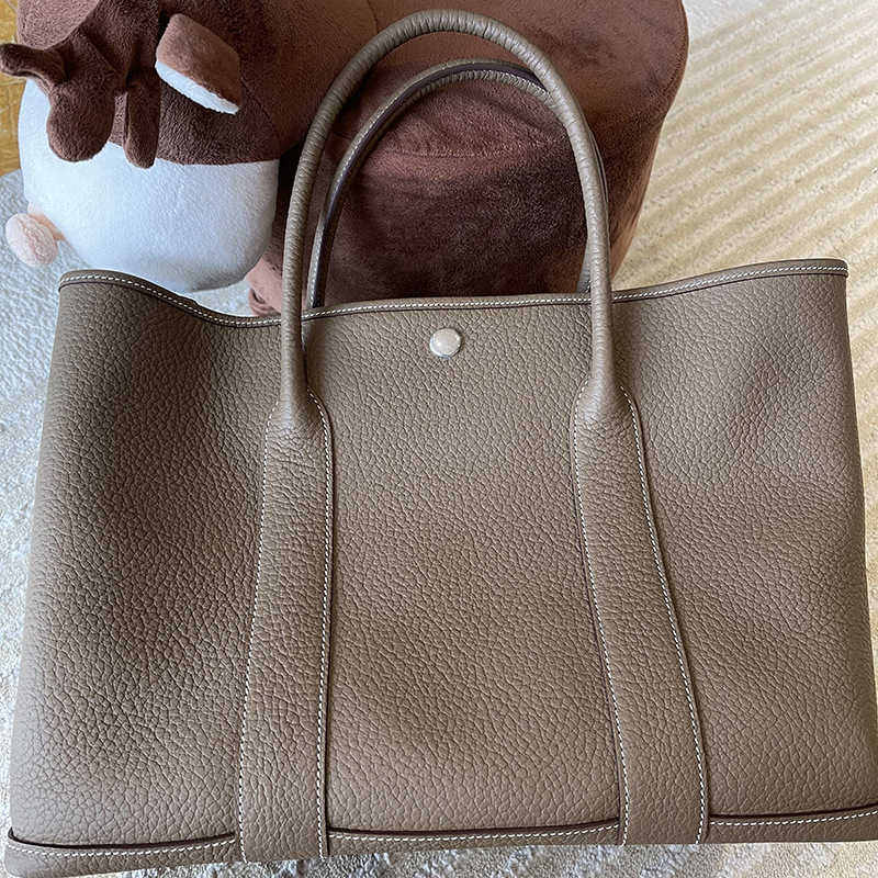 

Luxurious Designer Herme bags Leather women's Kangkang stewardess garden hand togo leather sewn, Grey