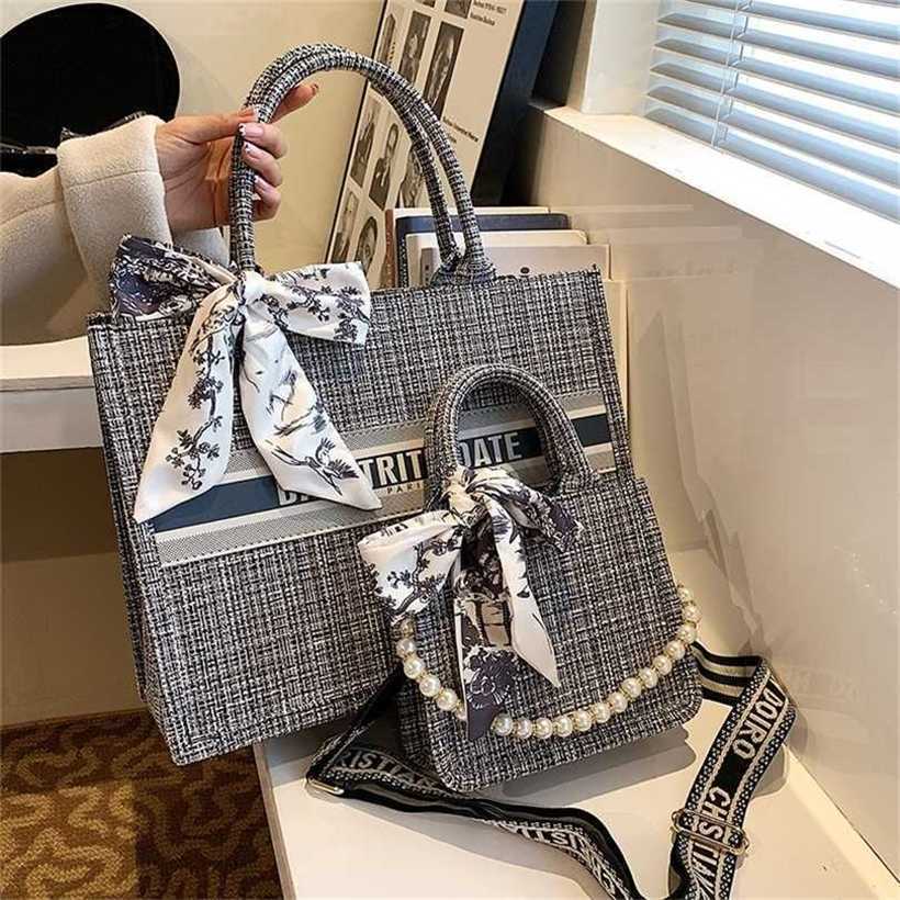 60% OFF 2023 Designer bag Tote bow knot sense canvas large capacity hand women's autumn and winter minority letter