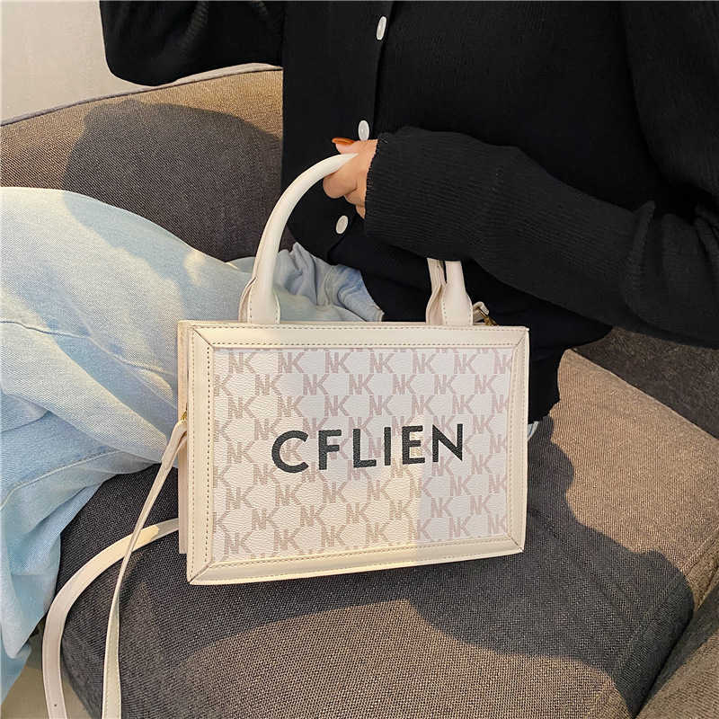 

Vertical Line Cell Canvas Phone Genuine Cabas Leather 2022 Popular Women's Bag High Sense Tote Fashionable One Shoulder Messenger Hand Women