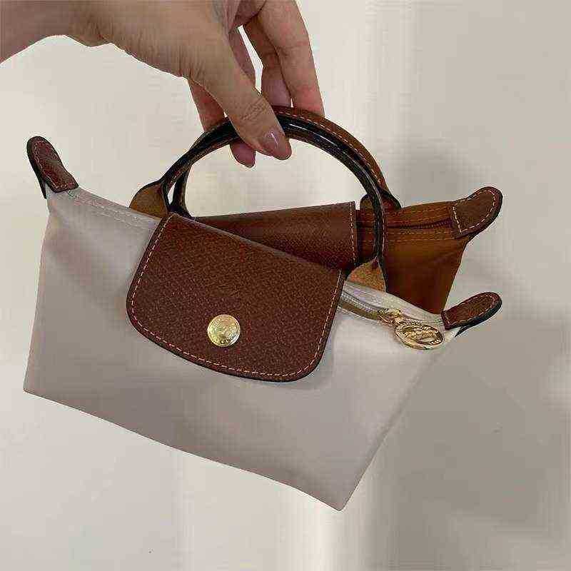 

Brand new French Longxiang Bag Portable Mini Bags Female Cognac Lc Short Handle Nylon Cosmetic Dumpling handbags, White