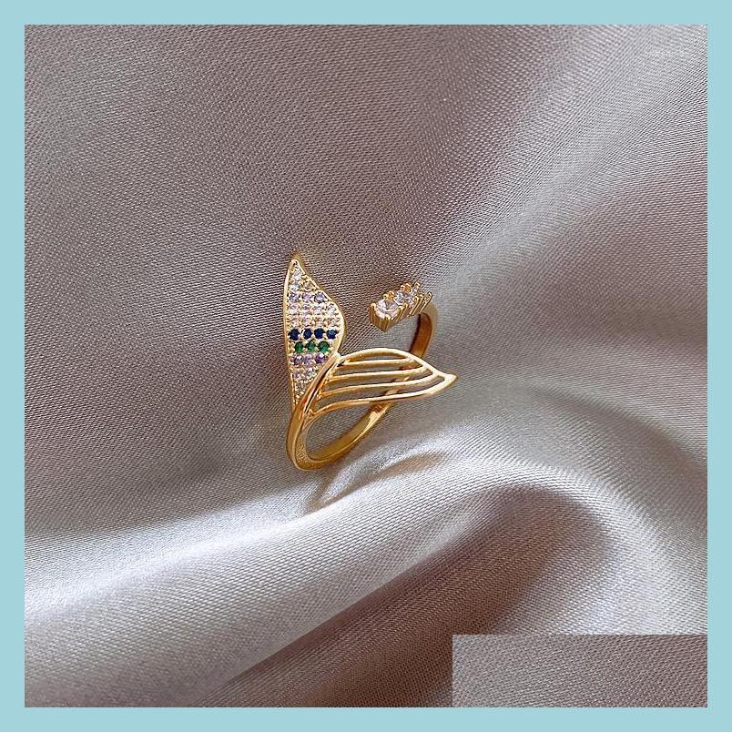 

Cluster Rings Cluster Rings Korea Design Fashion Jewelry Creative Fish Tail 14K Real Gold Inlaid Zircon Asymmetric Hollow Female Ope Dhvks