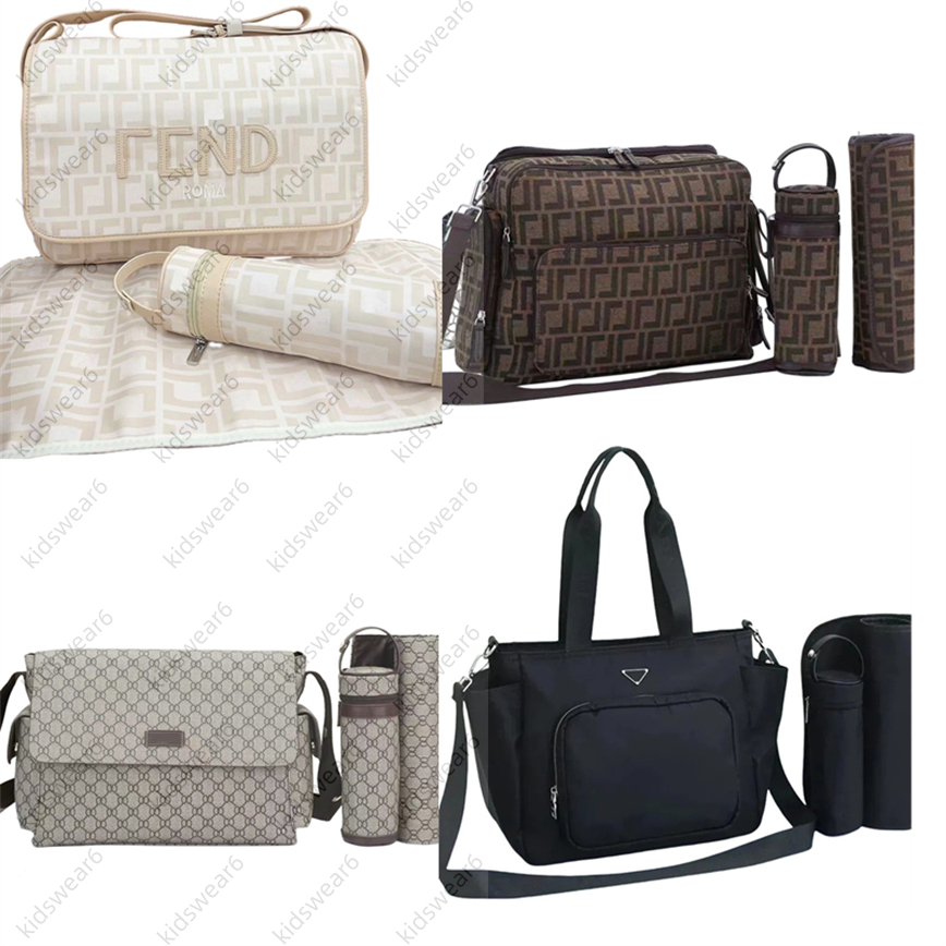 Sac à langer maman imperméable style designer 3 pochettes pour couches fermetures éclair bébé rose noir marron café plusieurs couleurs motifs à c