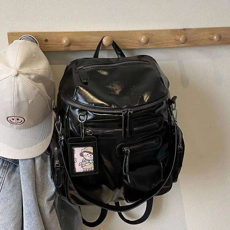 Sacs de créateurs seau de mode en forme de grande capacité en cuir breveté surface brillante Casual polyvalent et sac à dos de voyage en plein ai