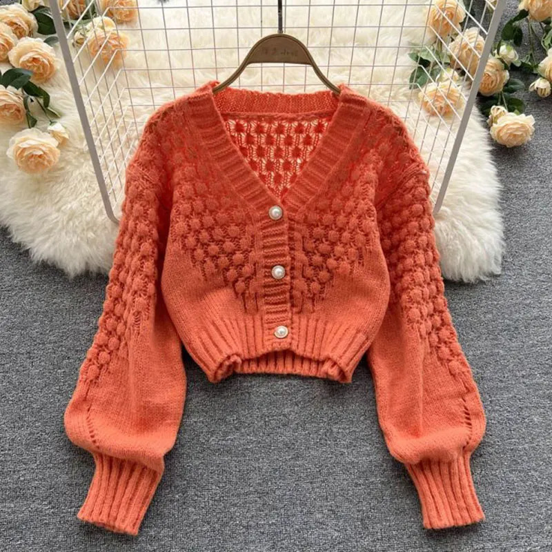 Orange Hollow Out acrylique en tricot à manches lanterne Vneck Cardigan single-poitrine simple Cardigan pour femmes vêtements 250919
