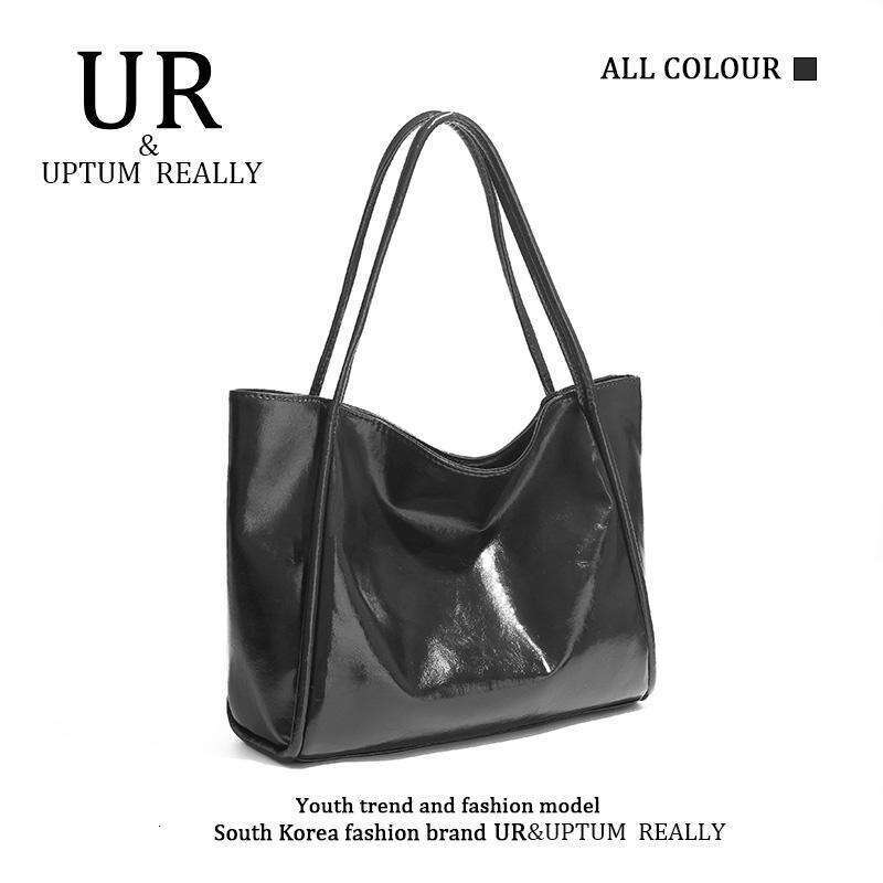 Ur Women's 2024 Nouveau en cuir en cuir doux à grande capacité Niche haut de gamme High-Up Feeling Student Class Class Hands Handd Sac