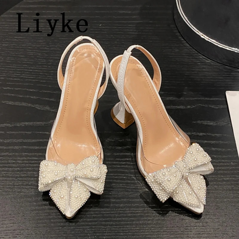 Liyke Summer Fashion Party Robe Slingback Shoes Pearl Bowknot Femmes Pumps sexy Toe pointu blanc High Heels Sandales transparentes250920