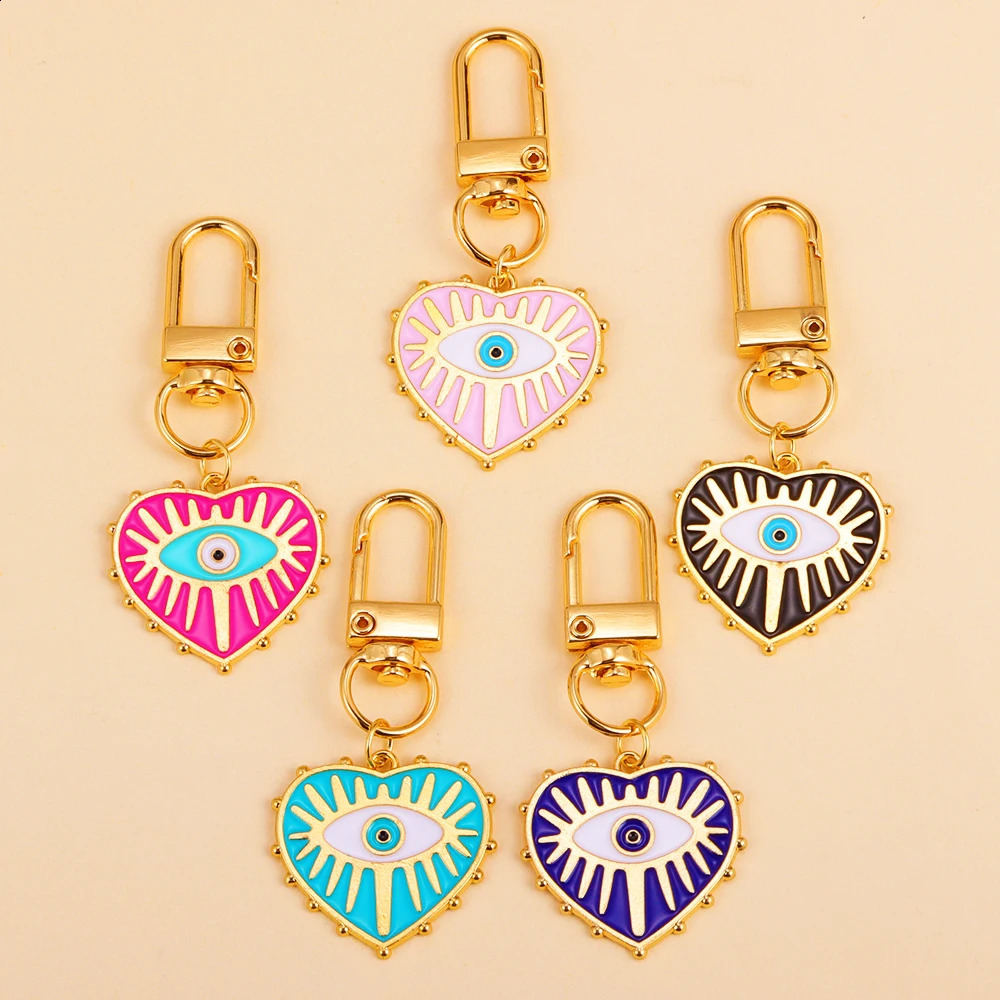 2pcs Chaînes clés en alliage Rotationnable Clâpe cavanage Evil Blue Eye Love Heart Pendant Femmes Femmes Car clés Décoration du sac Clés Accessor