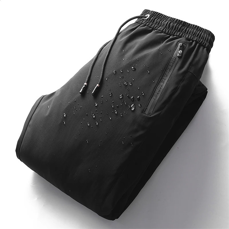 Automne et hiver haute qualité blanc canard vers le bas coton pantalon couleur unie coupe-vent pluie cordon pantalon mode hommes 240914