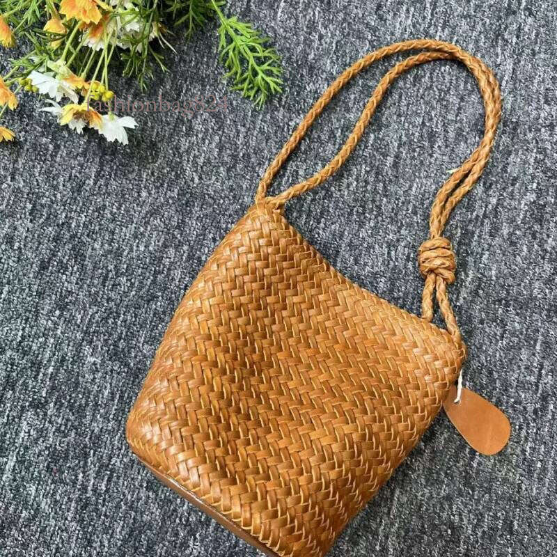 Hand-woven 2025 new French vintage vacation beach PU leather large capacity women's one-shoulder crossbody bucket bag