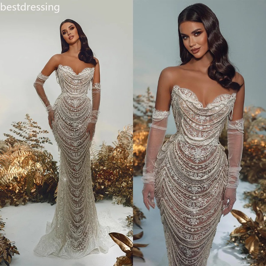 2025 Robes de mariée de sirène de perle de luxe Robes nuptiales de la mariée perles appliques à gland voir à travers illusion du train de balayag