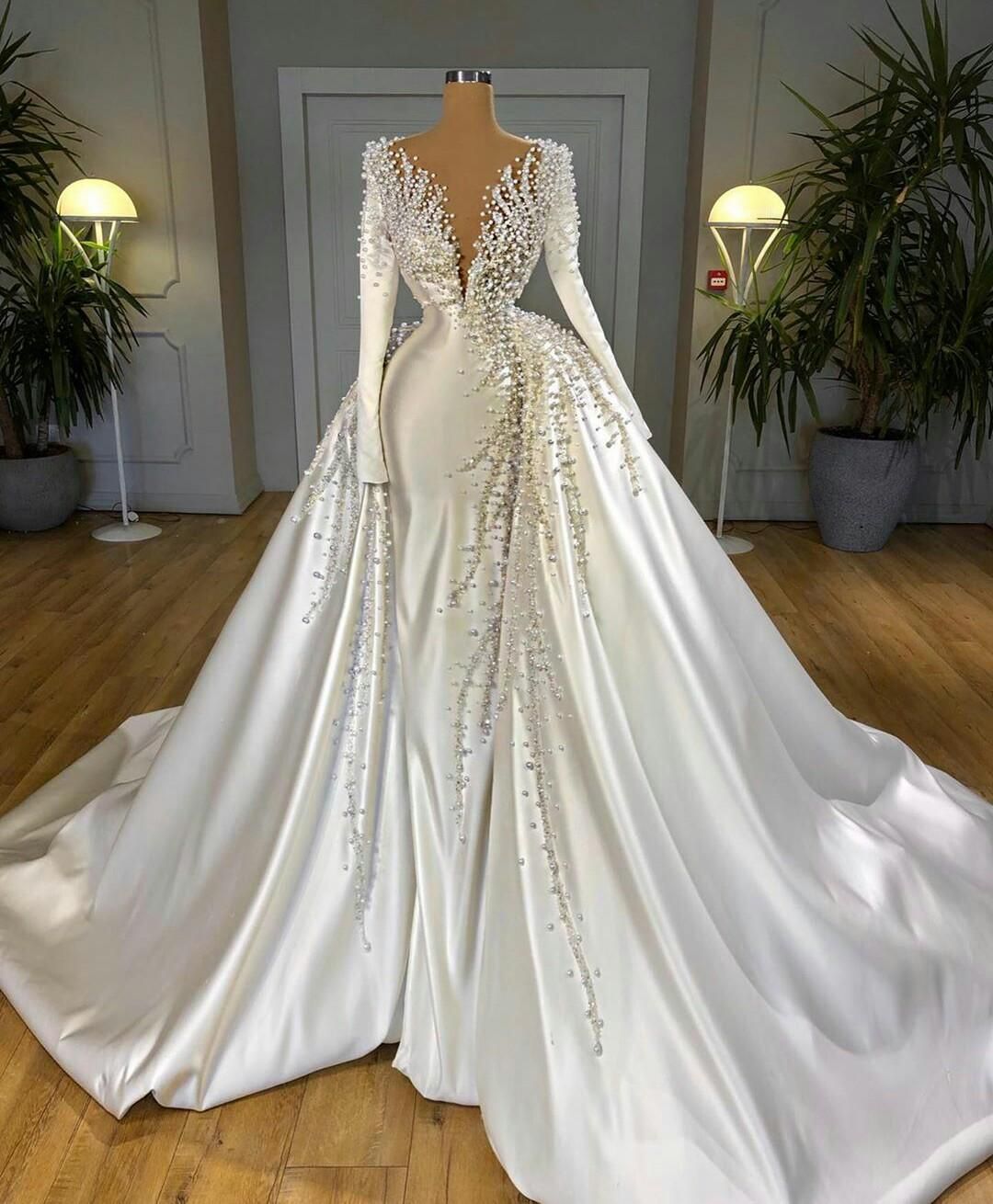 Elegant Mermaid Bridal Gown with Detachable Train Long Sleeve Wedding Dress adorned with Pearls and Beads