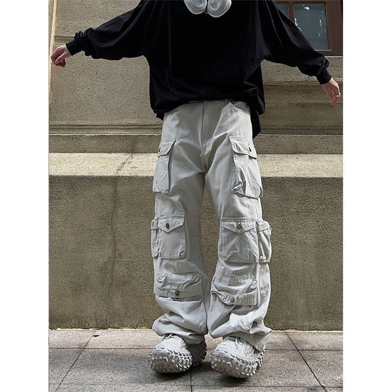 Pantaloni maschili strade multipocchi bianchi multiple in stile harajuku pantaloni casual sciolti dritti movping autunno 230317