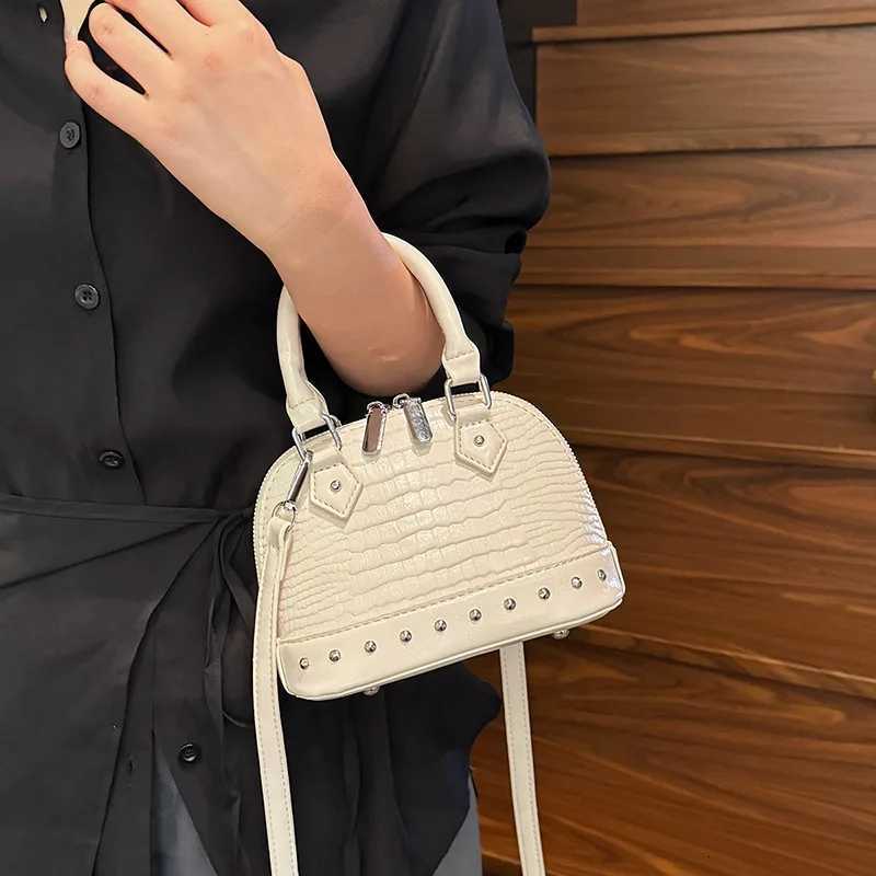 2025 Designer Shell Bag Niche Studded Top Handle Purse Elegant Versatile Shoulder Crossbody Bag for Women Stylish Commute W250924