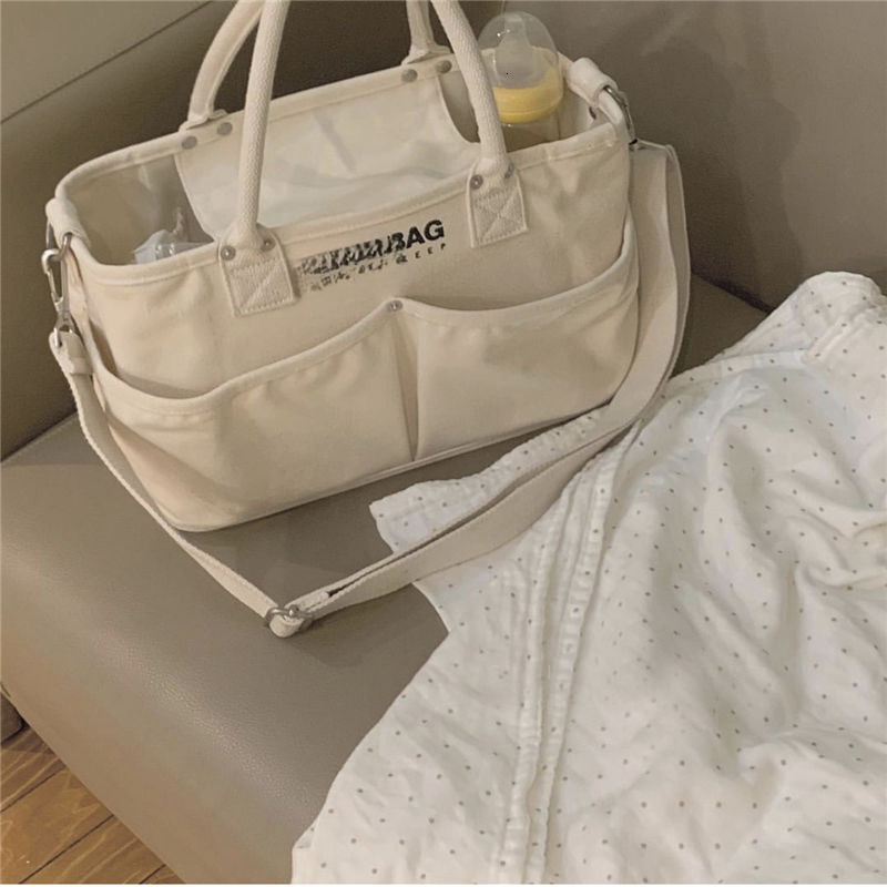 New handheld baby bag lightweight and large capacity mother bag fashion women s canvas handbag designer bag shoulder bag crossbody bag