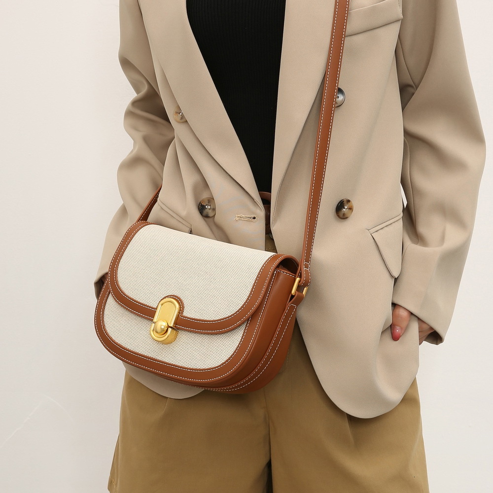 Free Shipping Designer Luxury Soft Leather High-quality Saddle Bag New Women's Simple Armpit Bag Urban Fashion Casual Shoulder Bag Spliced Hand