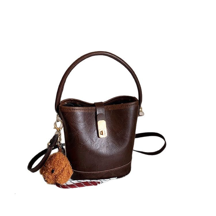 2025 New Style Free Shipping Designer Bucket Handbag Black Brown Beige Pendant For Luxury Bag Womens'daily Leisure Bags