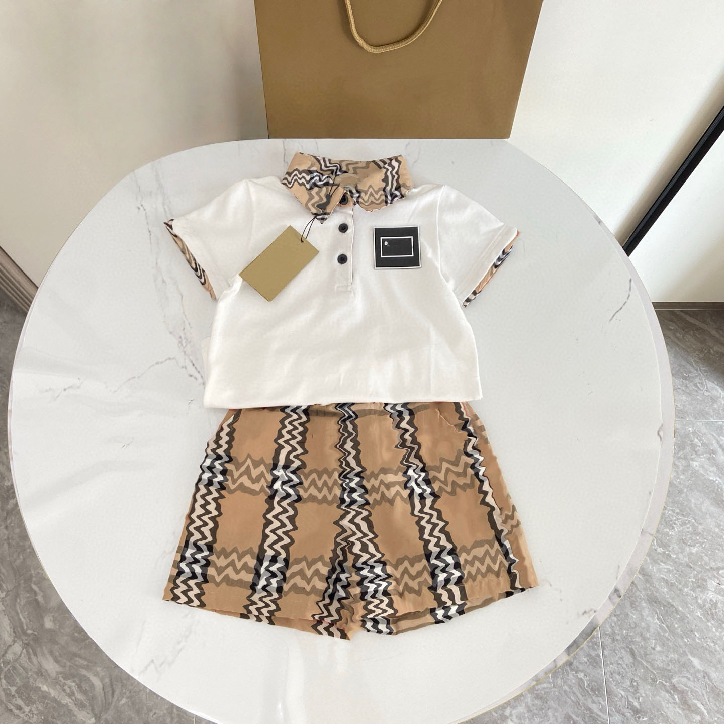 Baby designer clothes 2025 New summer fallow plaid round neck square neck Baby Clothing Men and Women Cartoon Short sleeved Striped Shorts 2-piece S