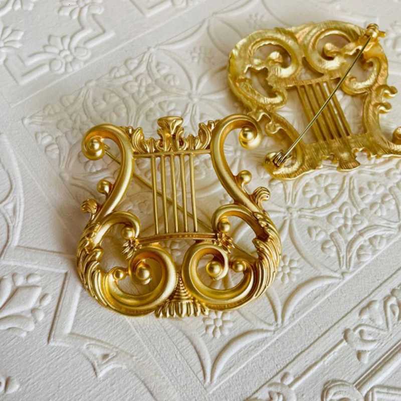 Broche de harpe de harpe dorée vintage broche de combinaison de musique pour cardigan sweater rétro-cadeau articles xj250815
