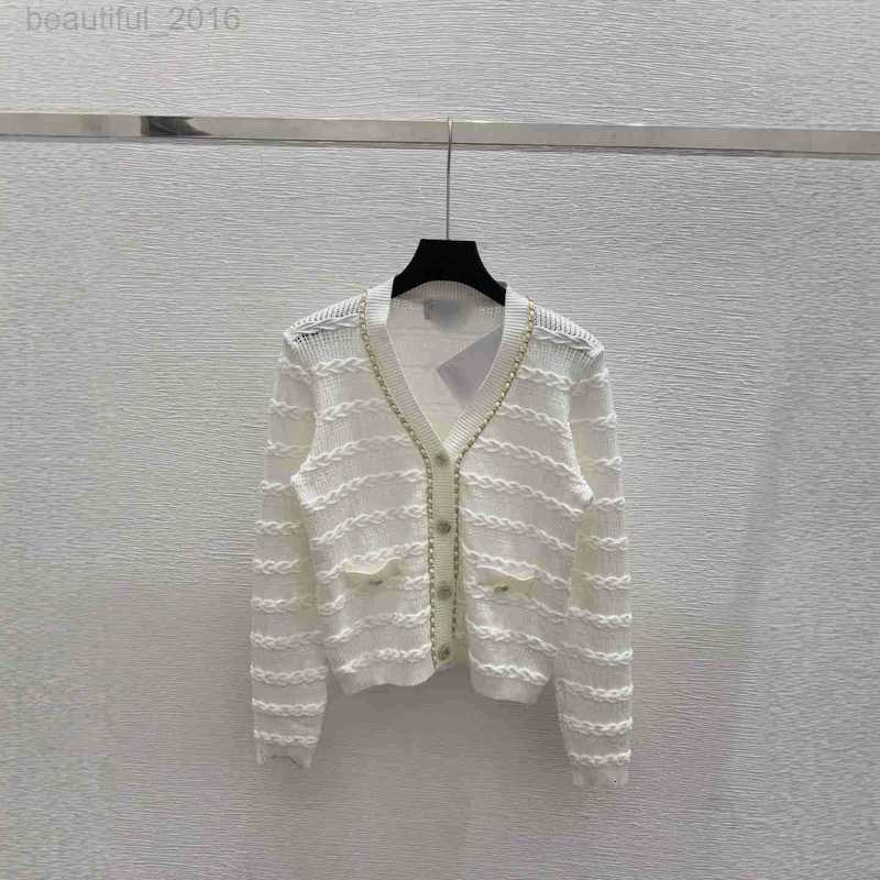 Traine de tricots pour femmes concepteur ch maison 25 en début d'automne Nouvelle chaîne de bouton de fleur CC V-collier à manche longue cardigan