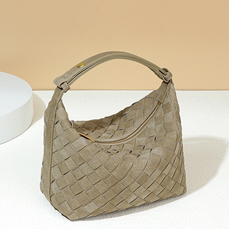 2025 New Women's Designer Texture Soft Leather Hand Woven Bag Fashionable Multi Functional Handheld Lunch Box Bag High End Leisure Shoulder Und