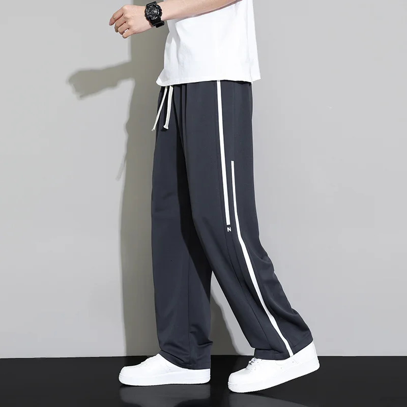 Pantalon de survêtement d'été hommes joggeurs pantalon de jambe large neutre respirant lâche extérieur de séchage rapide mode pantalon décontract