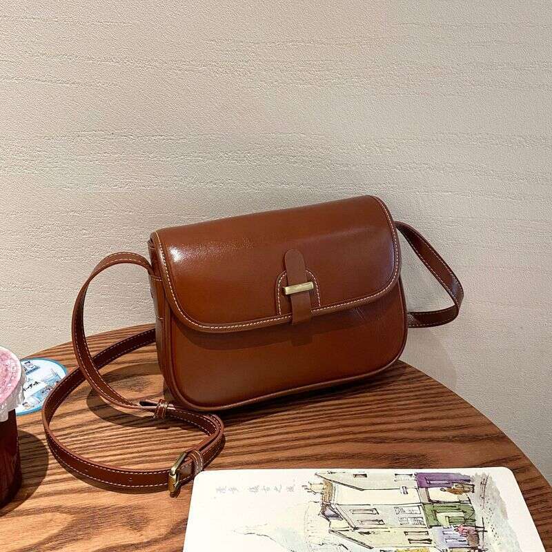 Vegetable tanned top layer cowhide single shoulder crossbody women's fashionable practical saddle bag, versatile and