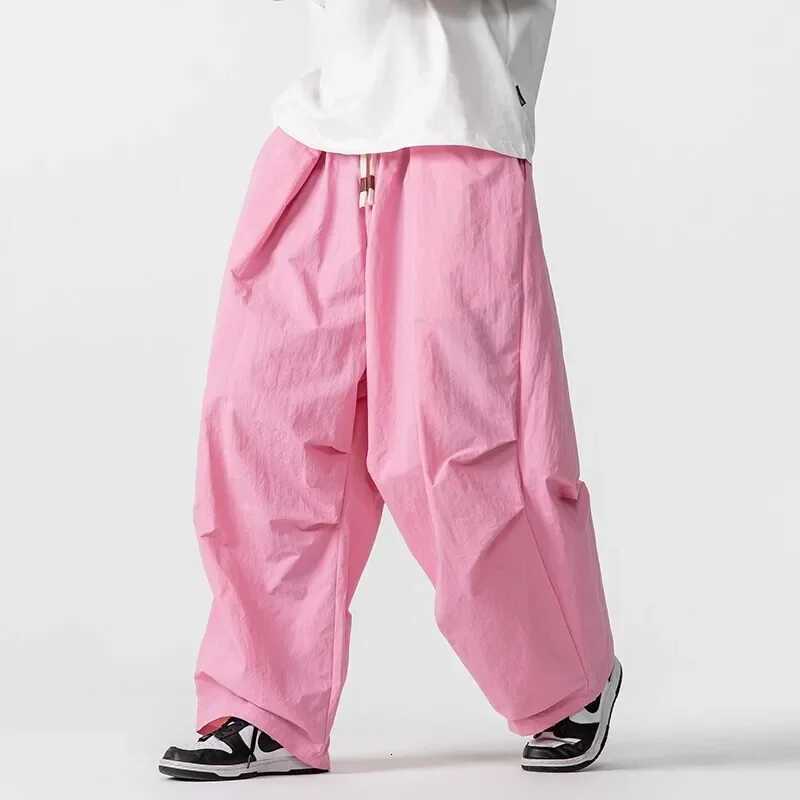 Pantalons de fret de style américain hommes lâches élastiques à la taille large pantalon de jambe respirante harem harem harem pantalon de mode d