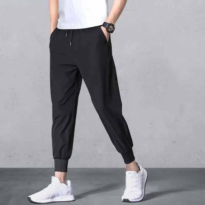 2024 Fashion Casual Pants Mens Summer Korean Edition Slim Fit Trend Versatile High Elastic Sports Pants Solid Color Casual Pants XJ250821