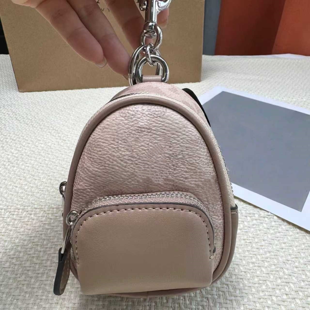 DHgate Luxury Bag Charm Designer co ch Keychain wallet for Womens Mini Bags Leather Keyring Stylish Keychain Hangings mini backpack coin purse