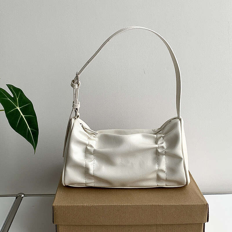 Design plissé de style coréen sous les bras pour femmes nouveau sac à main de niche.