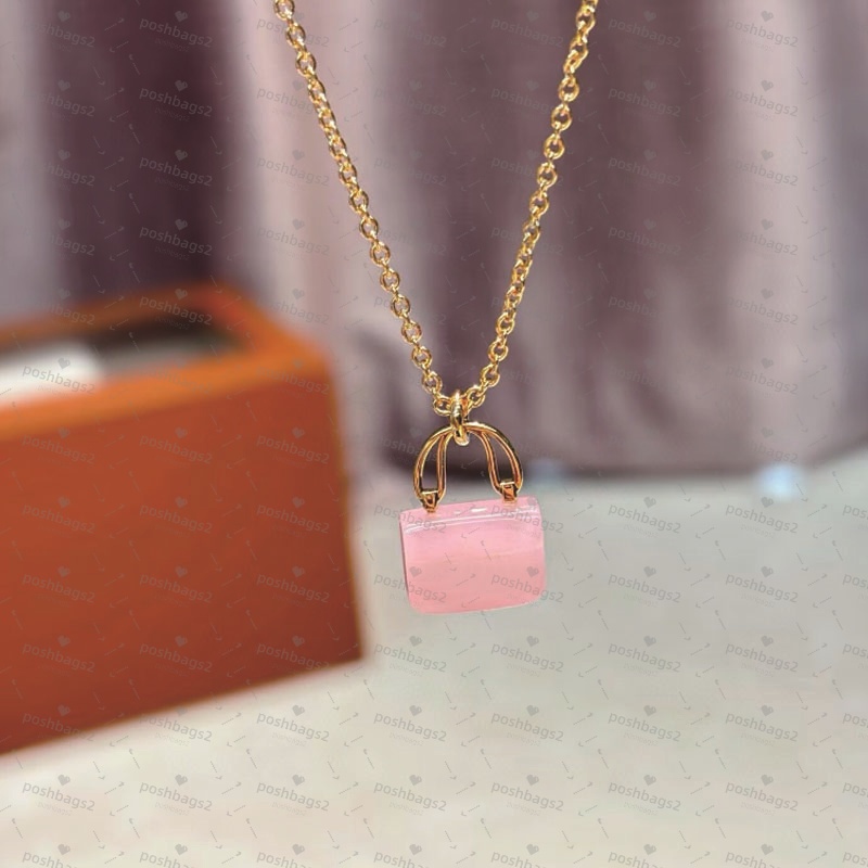 Collier de mode rose pour les bijoux féminins vendus avec des colliers à charme à sac à main pour les ventes