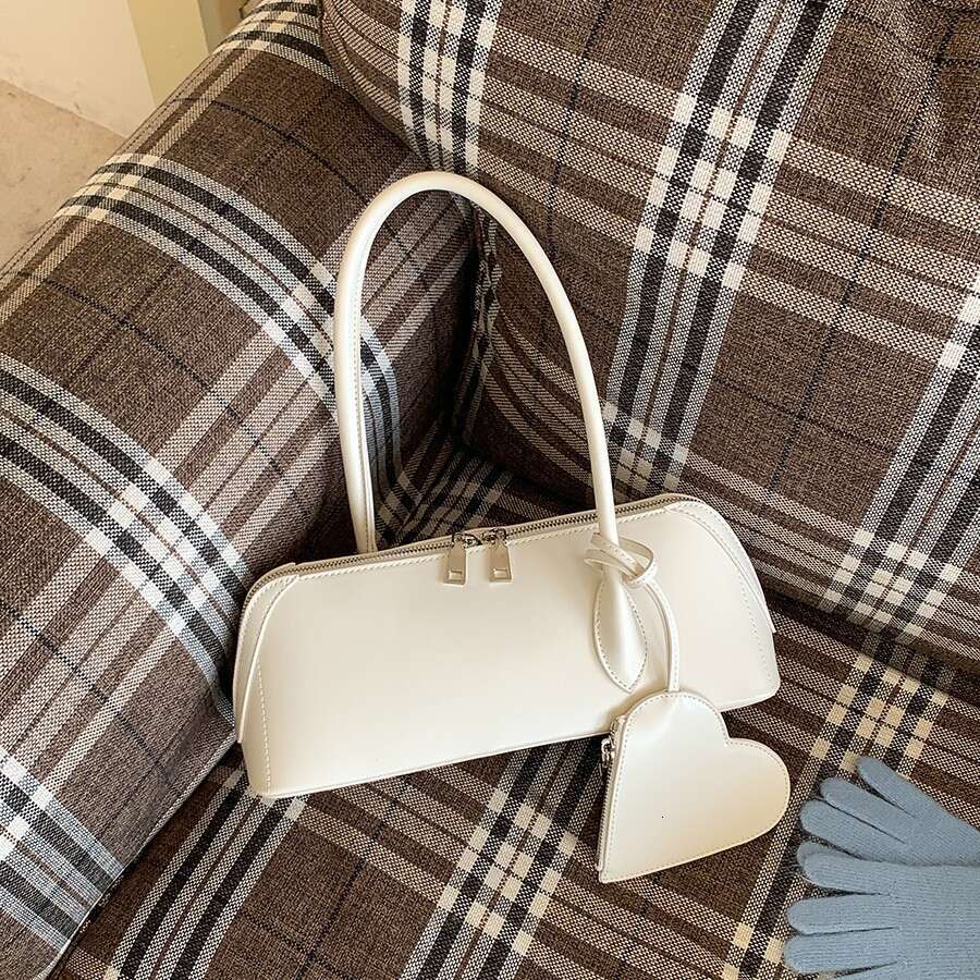 Men de niche de style niche pour femmes, sac à main de mode simple, sac baguette, coeur double fermeture éclair, version coréenne Nouveau sac à b