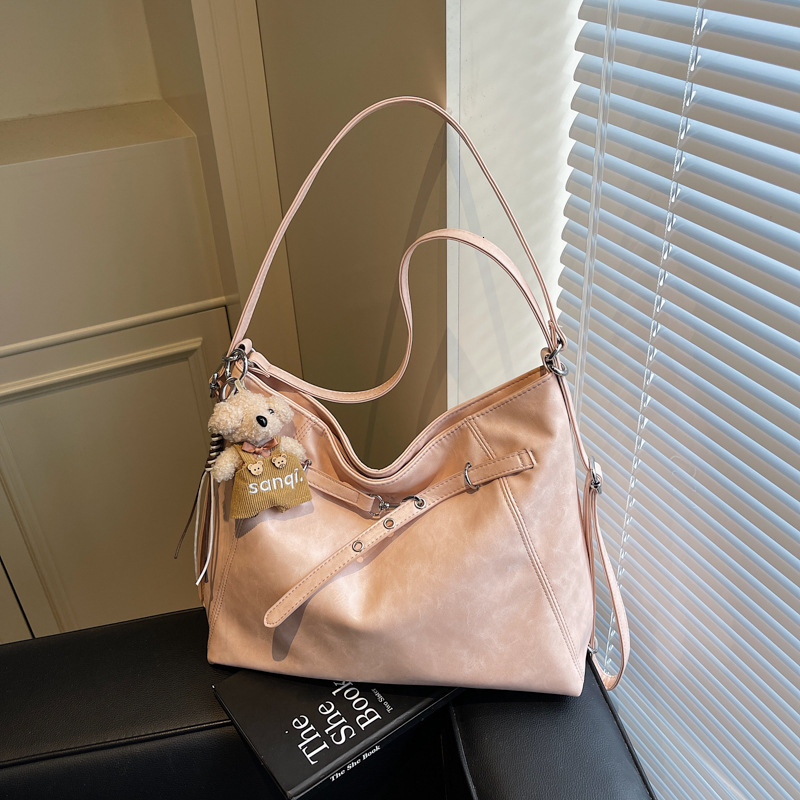The new large-capacity light luxury commuter multi-functional luxury bag for women in 2025 has been transformed into a double-shoulder basket bag