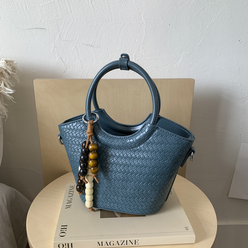 Free shipping designer bags Designer Niche Design Woven Handheld Bucket For Women Early Autumn New HighEnd Fashion Simple Single Shoulder Crossbody