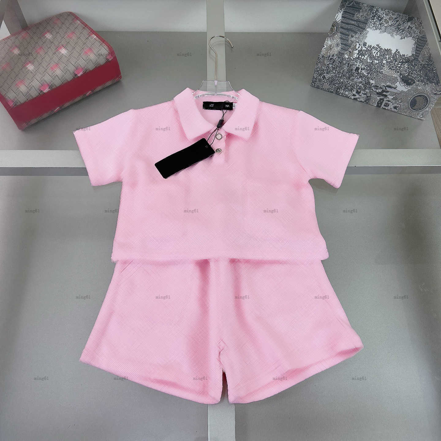 T-shirt bébé ensemble lettre d'été jacquard garçons filles à manches courtes à manches de créateurs de créateurs de créateurs polo et shorts A01x