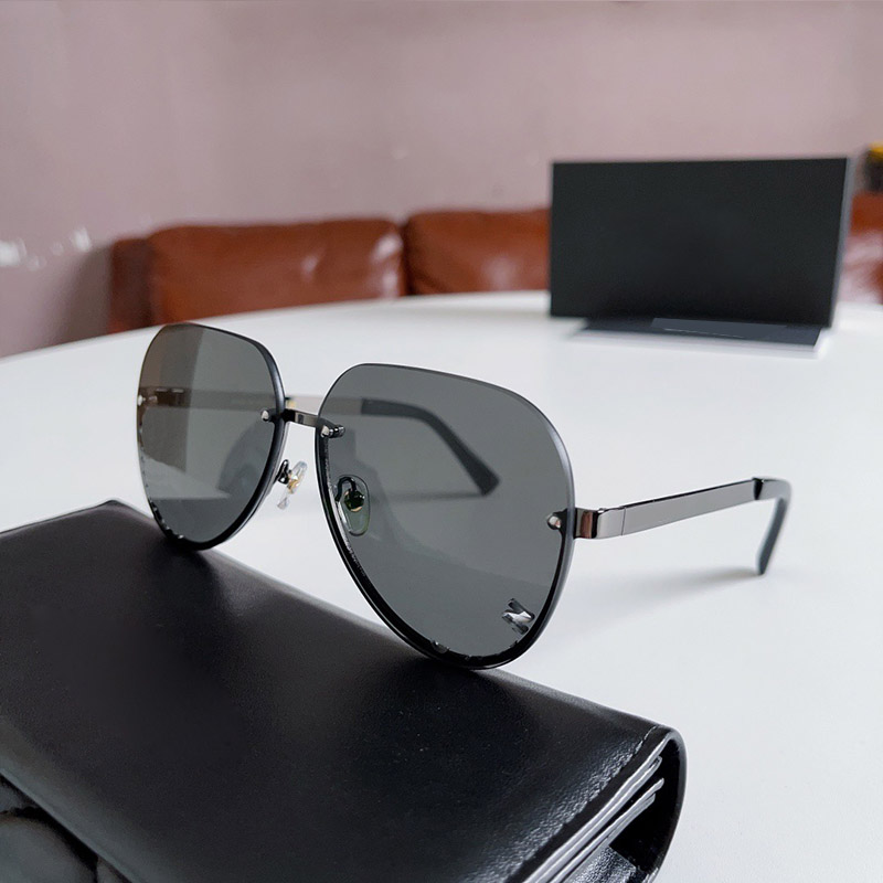 Fashion designer sunglasses for women luxurious frameless sunglasses classic hollow lenses, glasses with packaging box 95085 95086