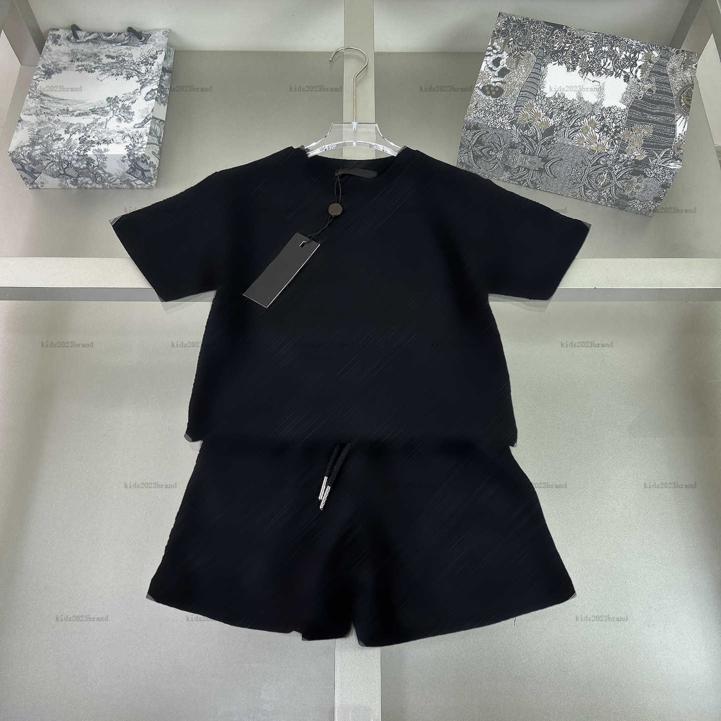 NOUVEAU T-shirt bébé Set Impression typiquement à manches courtes Boys Girls Tracks Tracks Clairs Clother Clothes T-shirt and short A12X05N035
