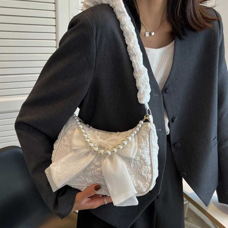 White pleated pearl womens bag retro luxury designer handbag cute bow shoulder bag fashionable Y2K retro womens bagXJ250504