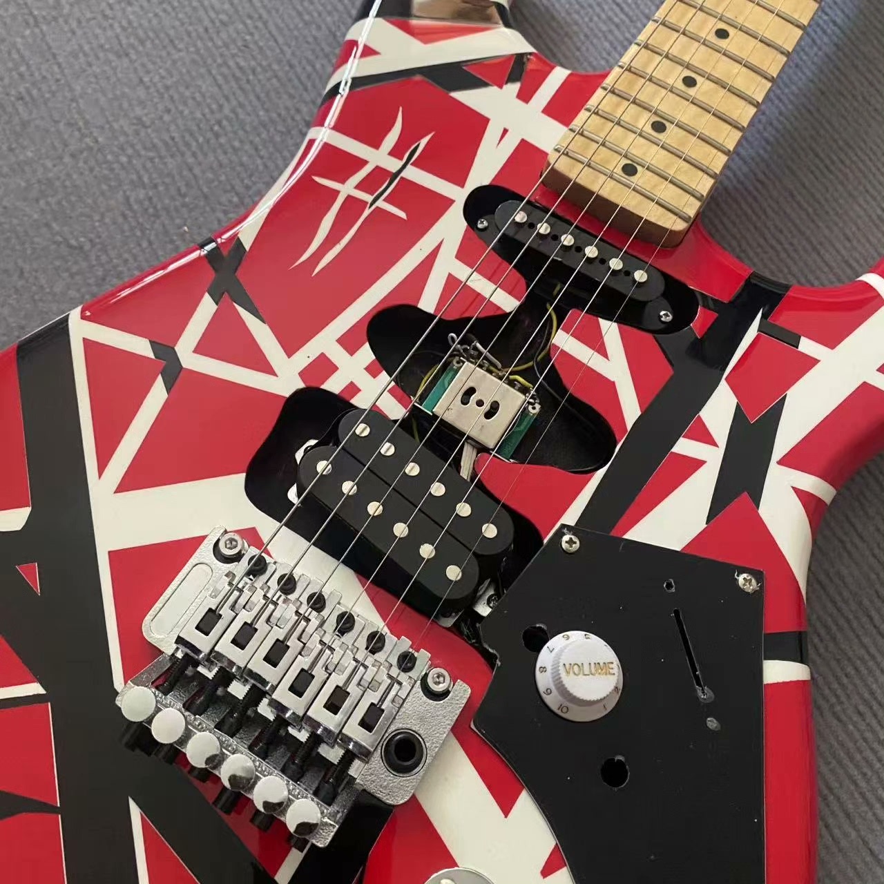 Bold Red Electric Guitar with Black/White Geometric Patterns, Maple Neck & Tremolo Bridge-image-1057920562