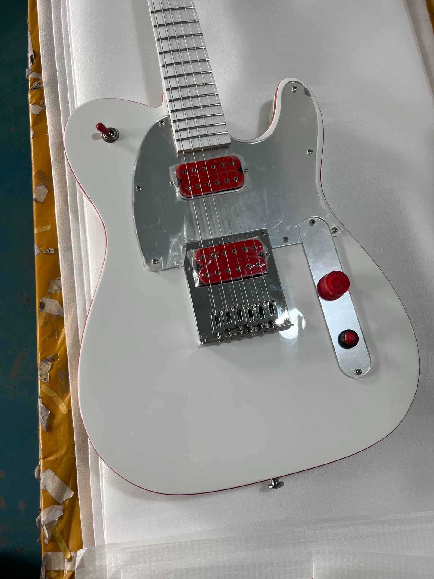 Glossy White Single-Cut Electric Guitar: Red Trim, Metallic Silver Plate & Dual Red Humbuckers-image-1058135289