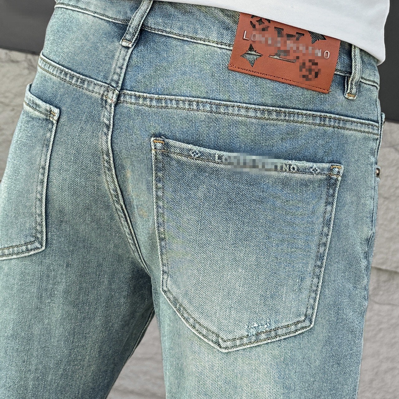 Jean coréen classique bleu déchiré pour les hommes de la mode à la mode d'été tendance skinny de cargaison de trous déchiré