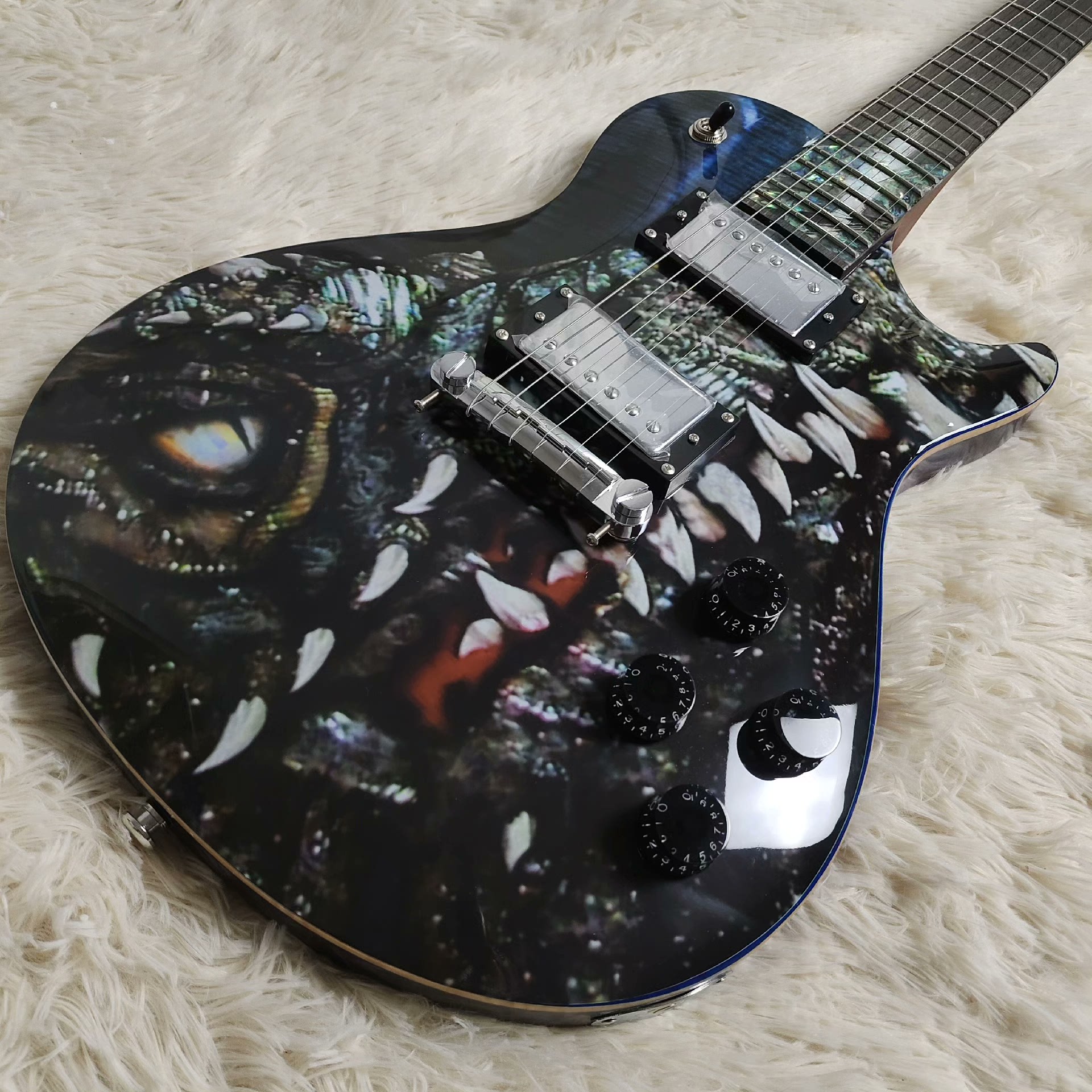 Striking Glossy Electric Guitar: Mythical Creature Eye/Teeth Graphic, Dual Silver Humbuckers-image-1058633861