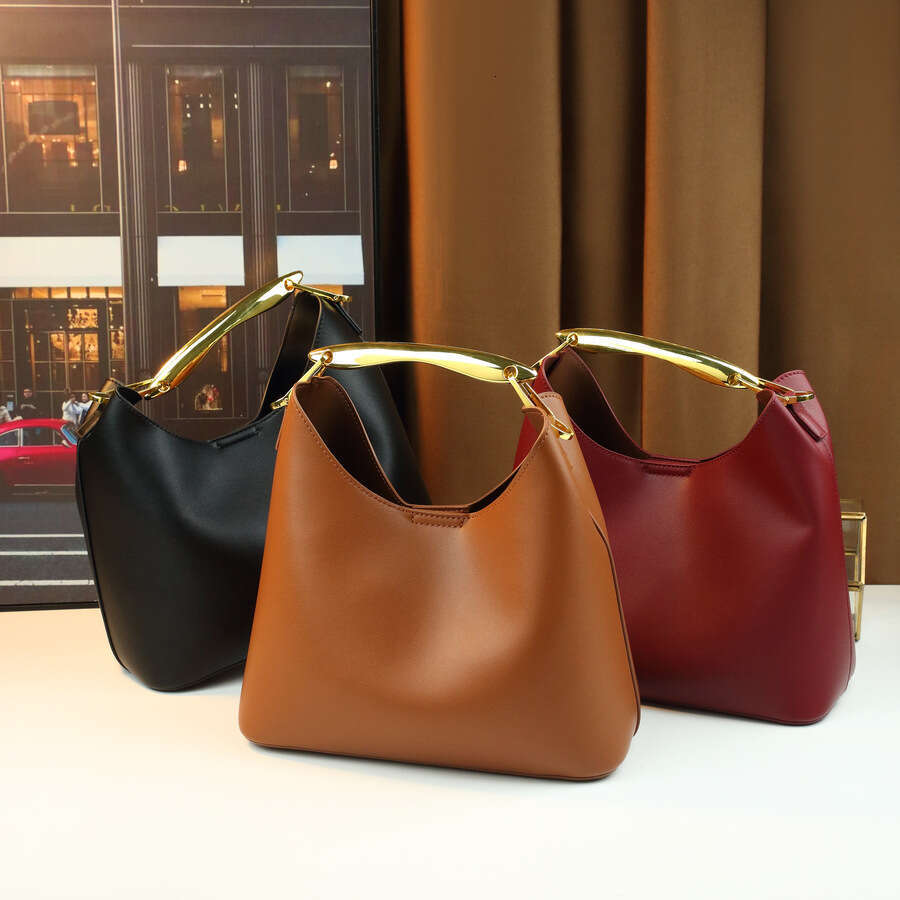 Sac de créateur mode poignée en métal couleur unie mère-fille transfrontalière nouvelles femmes à la mode sortie polyvalente sac seau à bandouliè