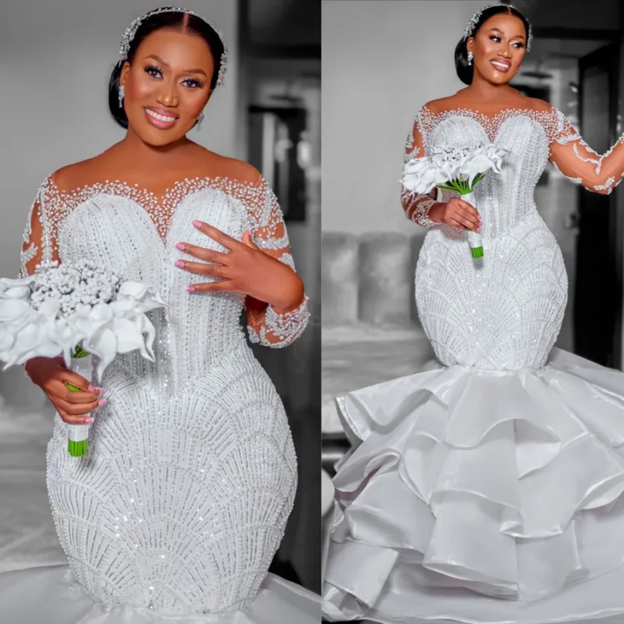 2026 Plus Size African Wedding Dress Bridal Gowns For Bride Mermaid Illusion Sheer Neck Long Sleeves Appliqued Beaded Lace Tiers Crystals 1204