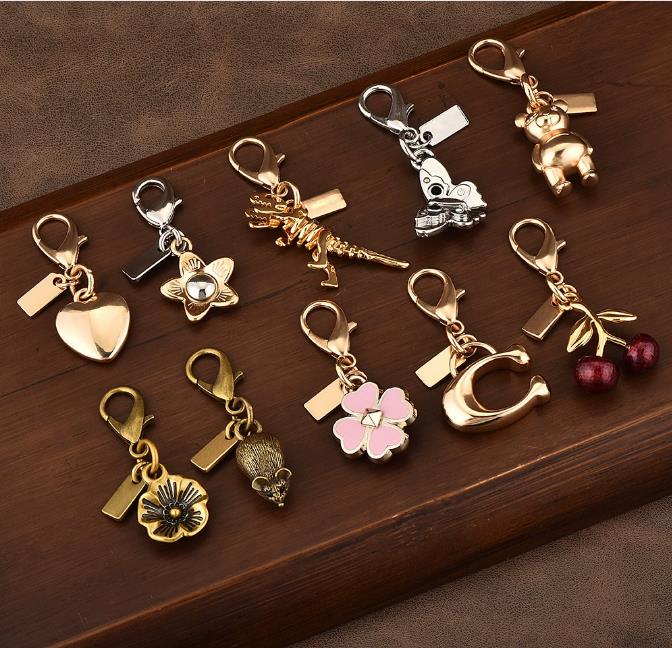 20style Designer Bag Charm Keychain Fashion Womens Golden Little Bear leaf Clover Butterfly Schoolbag Style Keyring Cherry Hangings key chain